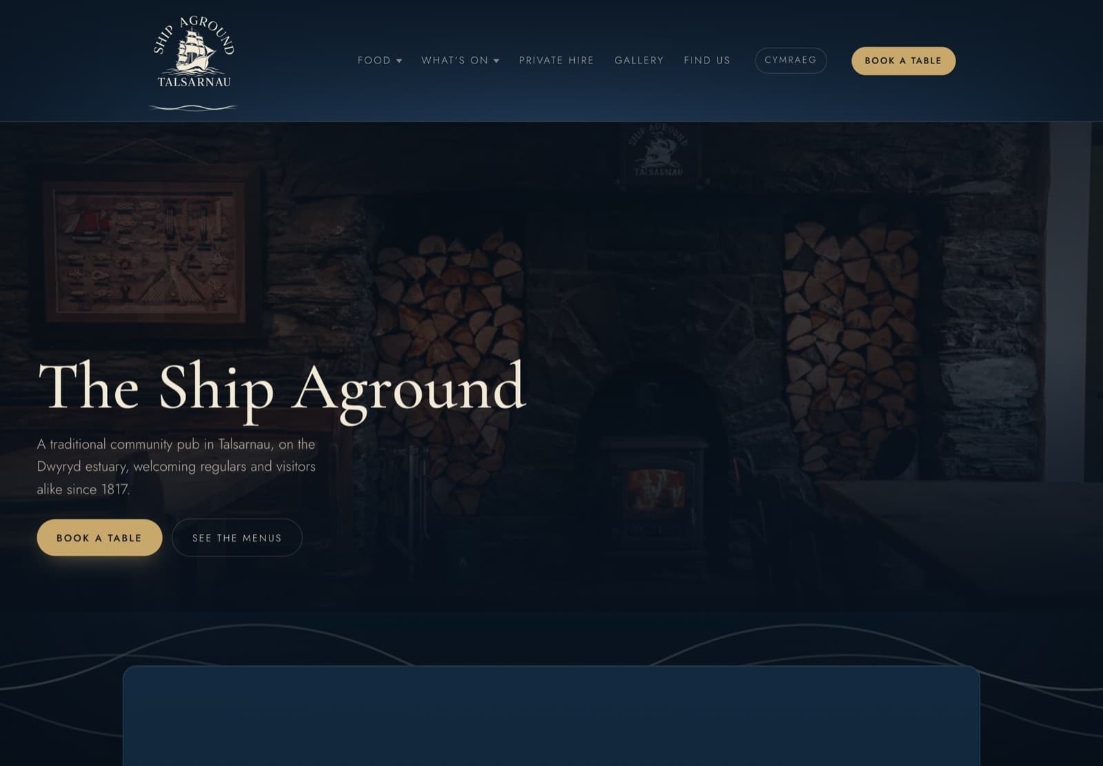 The Ship Aground website homepage, navy and cream with the pub's ship emblem