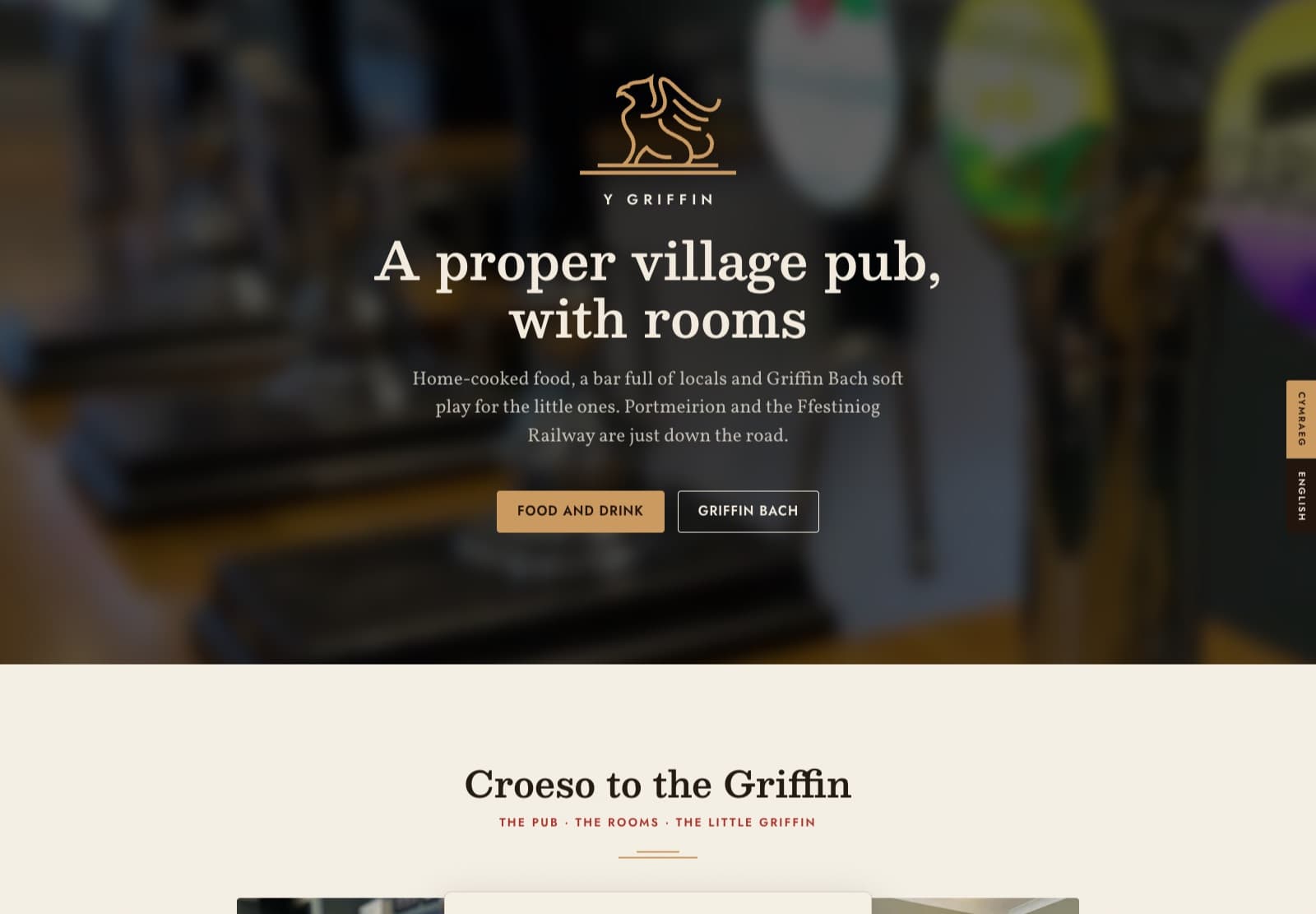 The Y Griffin website homepage, cream and chestnut with a gold griffin emblem over a photograph of the bar